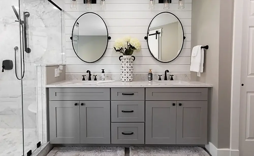 Spa-style bathroom remodel with natural tones and recessed lighting