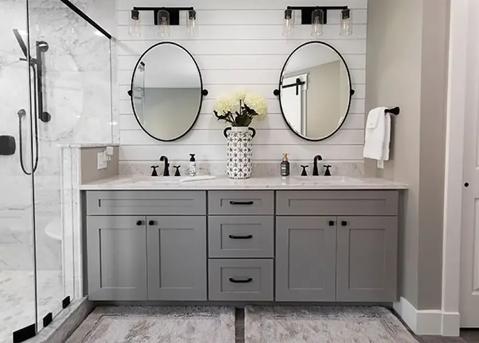 Spa-style bathroom remodel with natural tones and recessed lighting