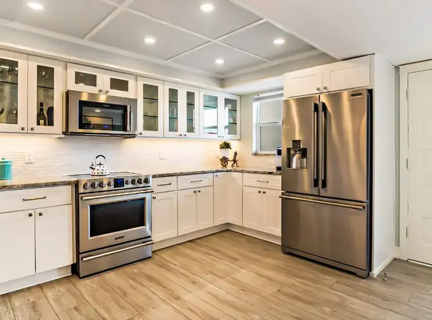 Modern kitchen remodel in Tampa with white shaker cabinets