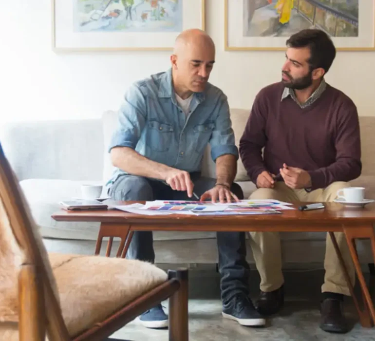 Customer shaking hands with contractor at project handoff